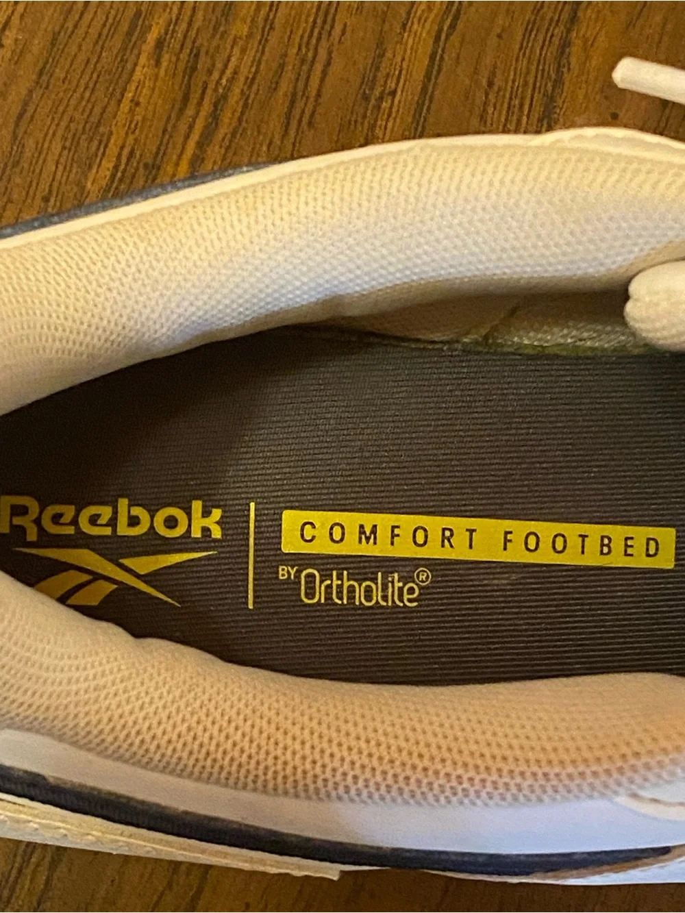 Reebok Women’s Ortholite White Athletic Sneakers with Navy Accents